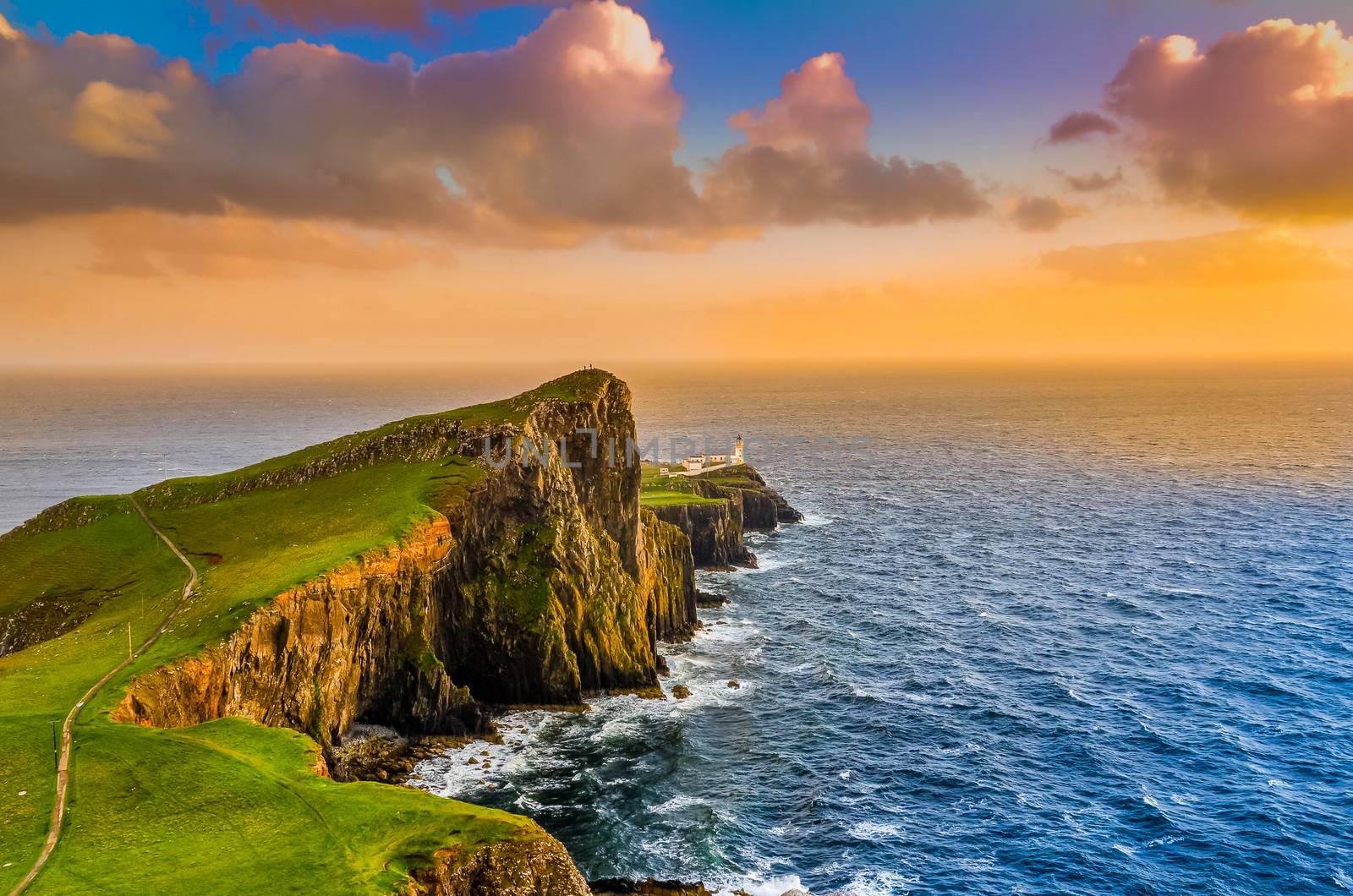 Colorful ocean coast sunset at Neist point lighthouse, Scotland, United Kingdom