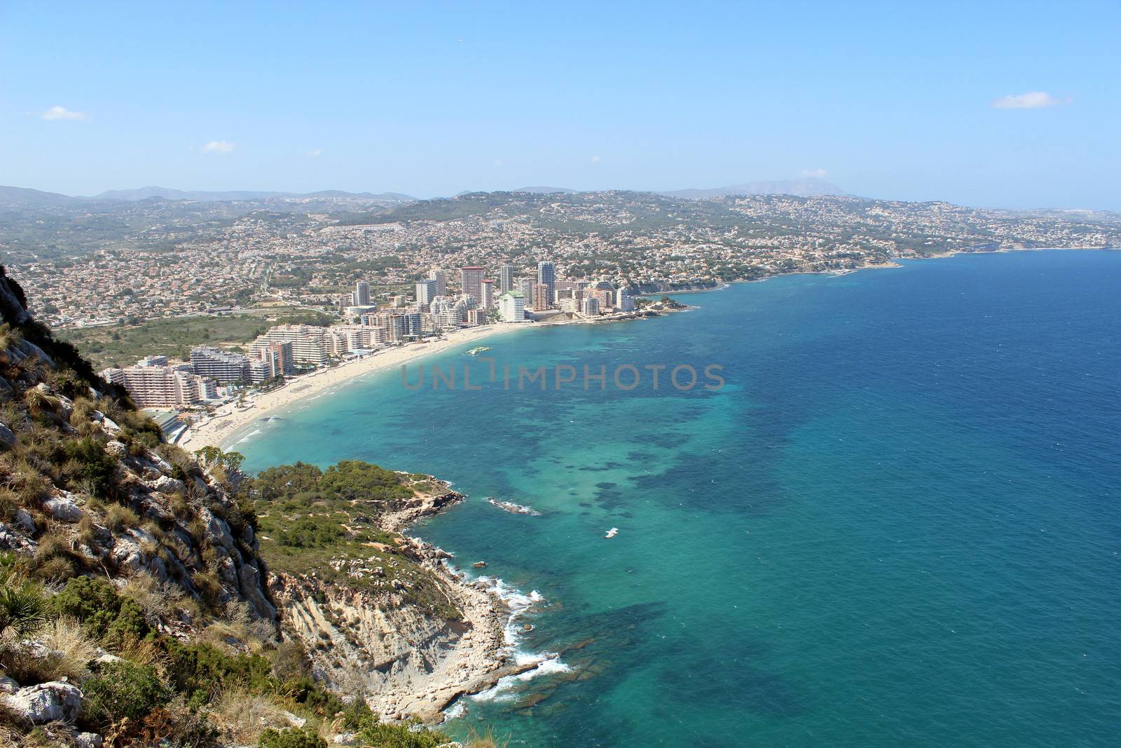 Panoramic view over Calp (Spain). Town bay beach