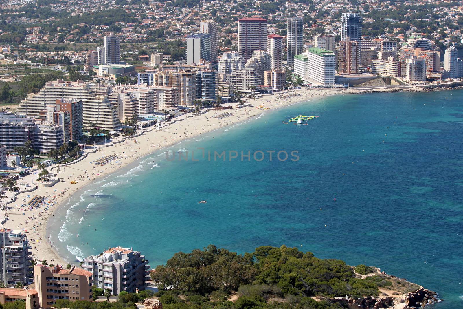 Panoramic view over Calp (Spain). Town bay beach