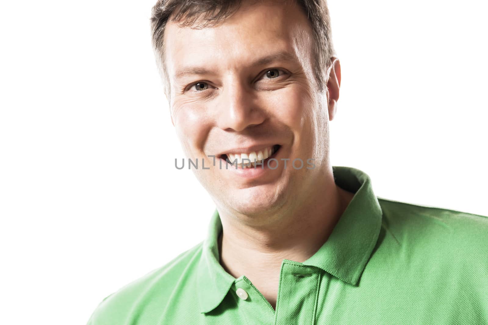 Portrait of a smiling and happy man in green shirt