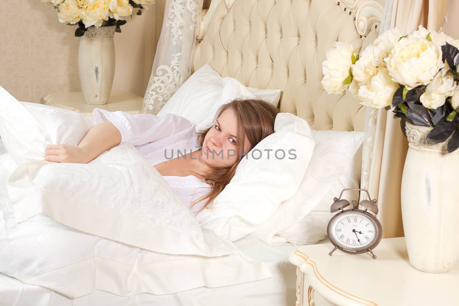 Sleepless woman lying in bed by victosha