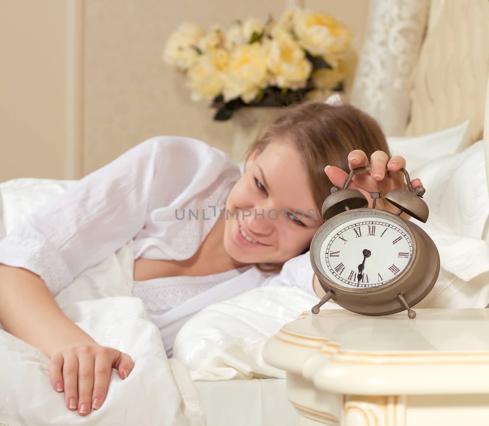 Woman's hand off the alarm clock by victosha