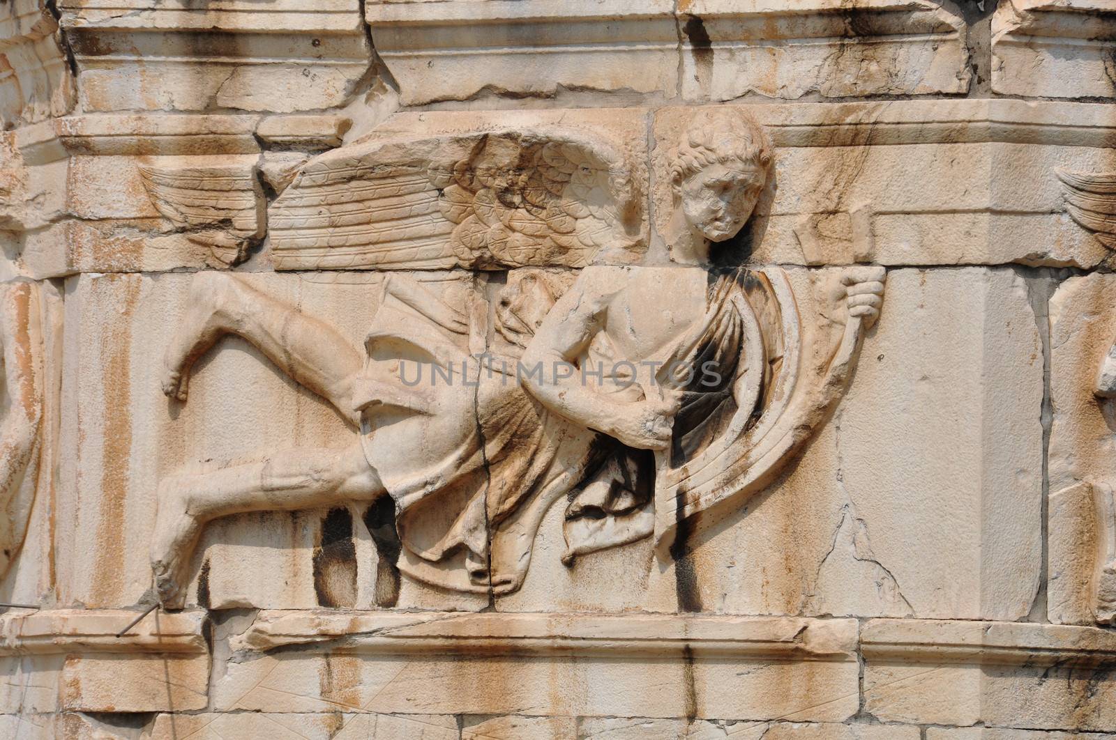 Tower of the Winds frieze detail of wind god pushing the stern of a ship. Ancient Agora, Athens Greece.