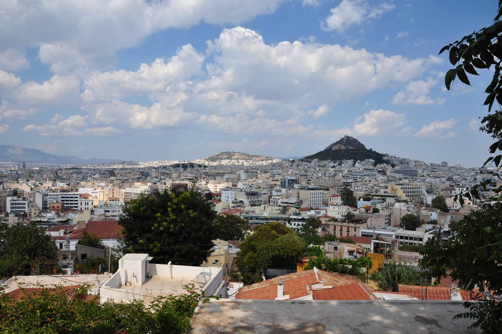 View of the city of Athens Greece and Lycabettus hill as seen from Plaka.