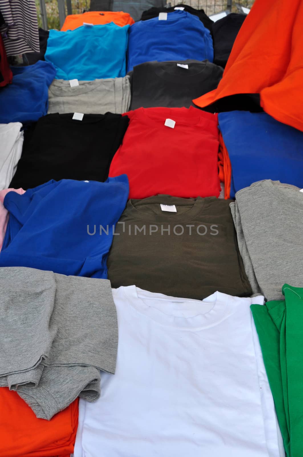 Short sleeve t-shirts colorful background. Casual summer clothes.