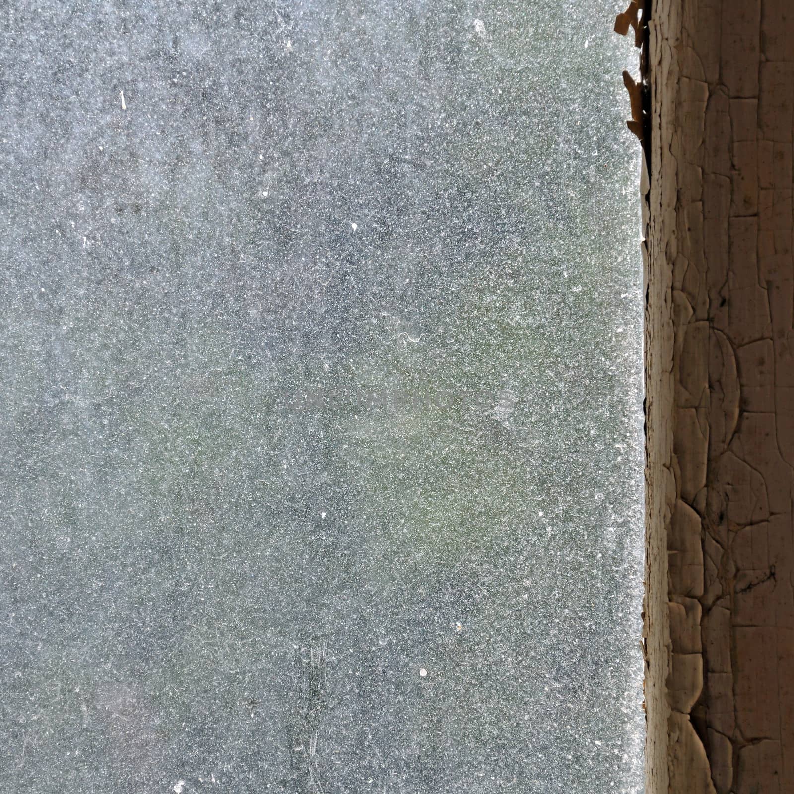 Dusty glass peeling wooden window frame abstract grungy background.