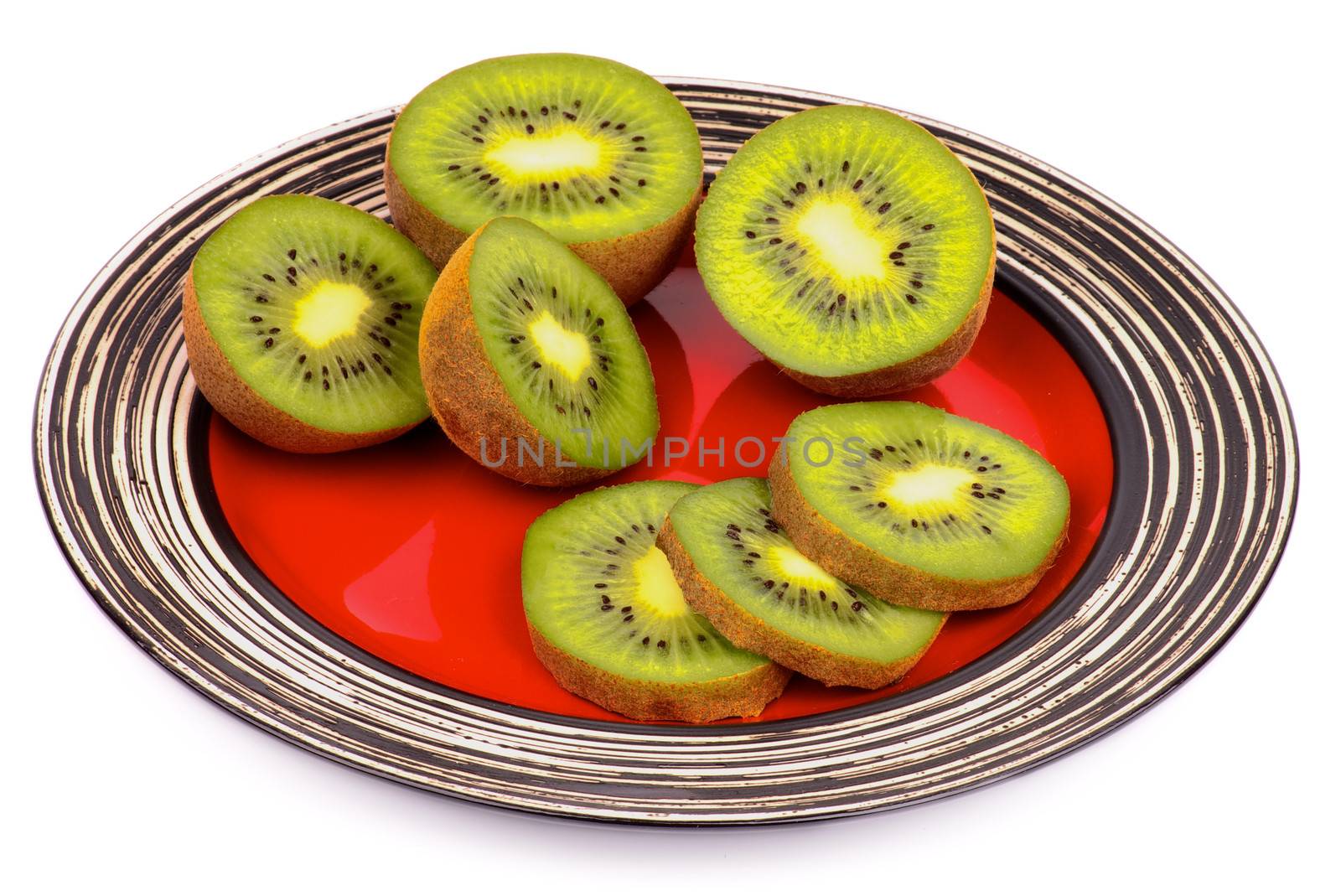 Perfect Ripe Kiwi Halves and Slices on Striped Red Plate isolated on white background