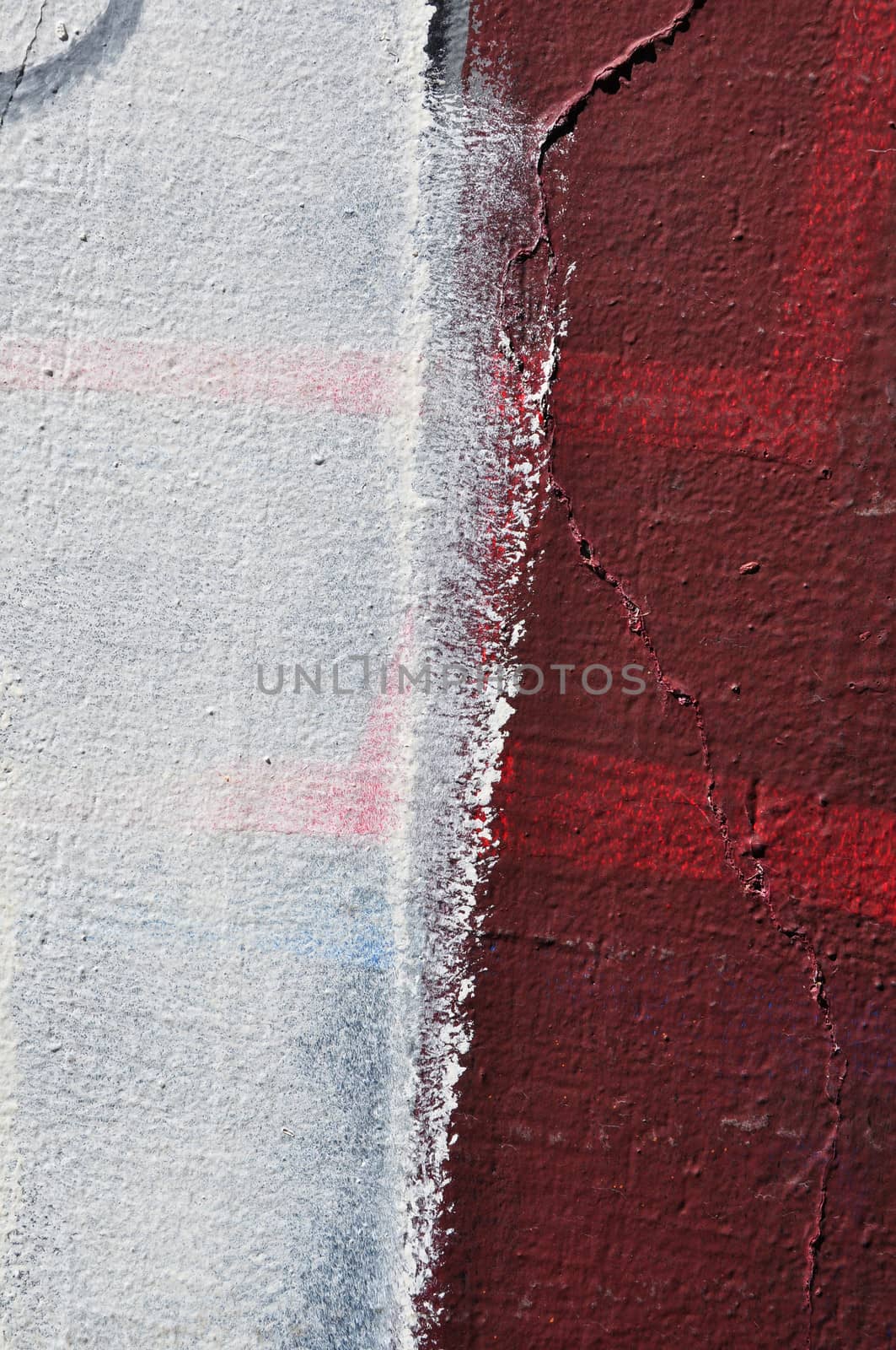 White paint smudged over textured wall. Abstract background.