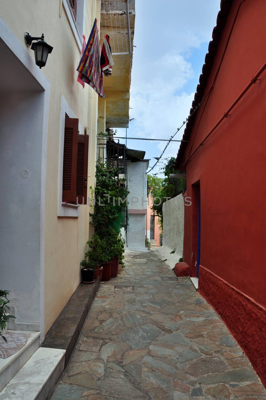 Traditional houses and narrow alley in Plaka, Athens Greece.