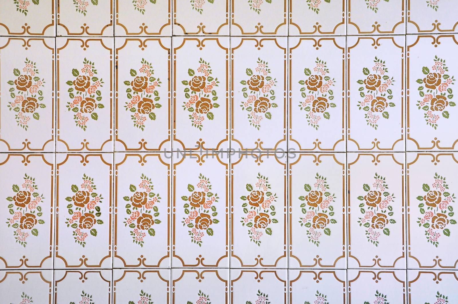 Kitchen wall tiles with floral pattern in a house built in 1970's. Vintage background.