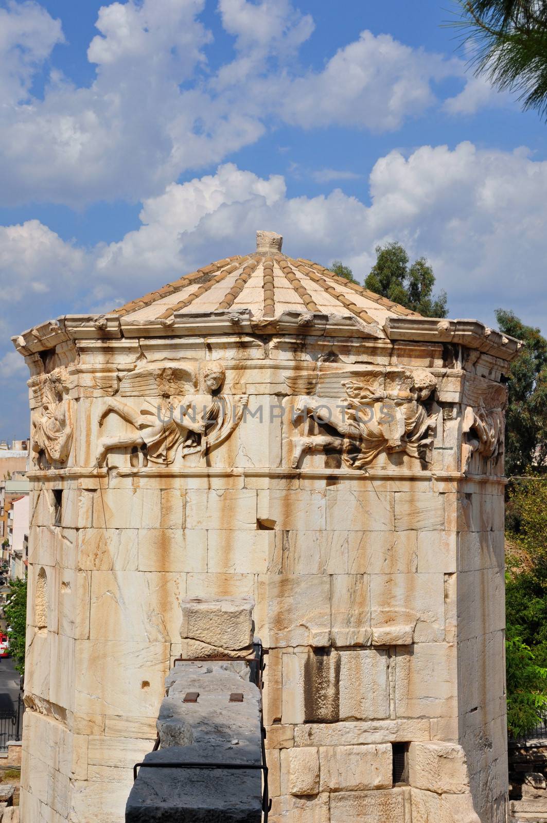 Tower of the winds ancient clocktower for monitoring weather and time later a church. Wind gods carved on marble frieze, Athens Greece.