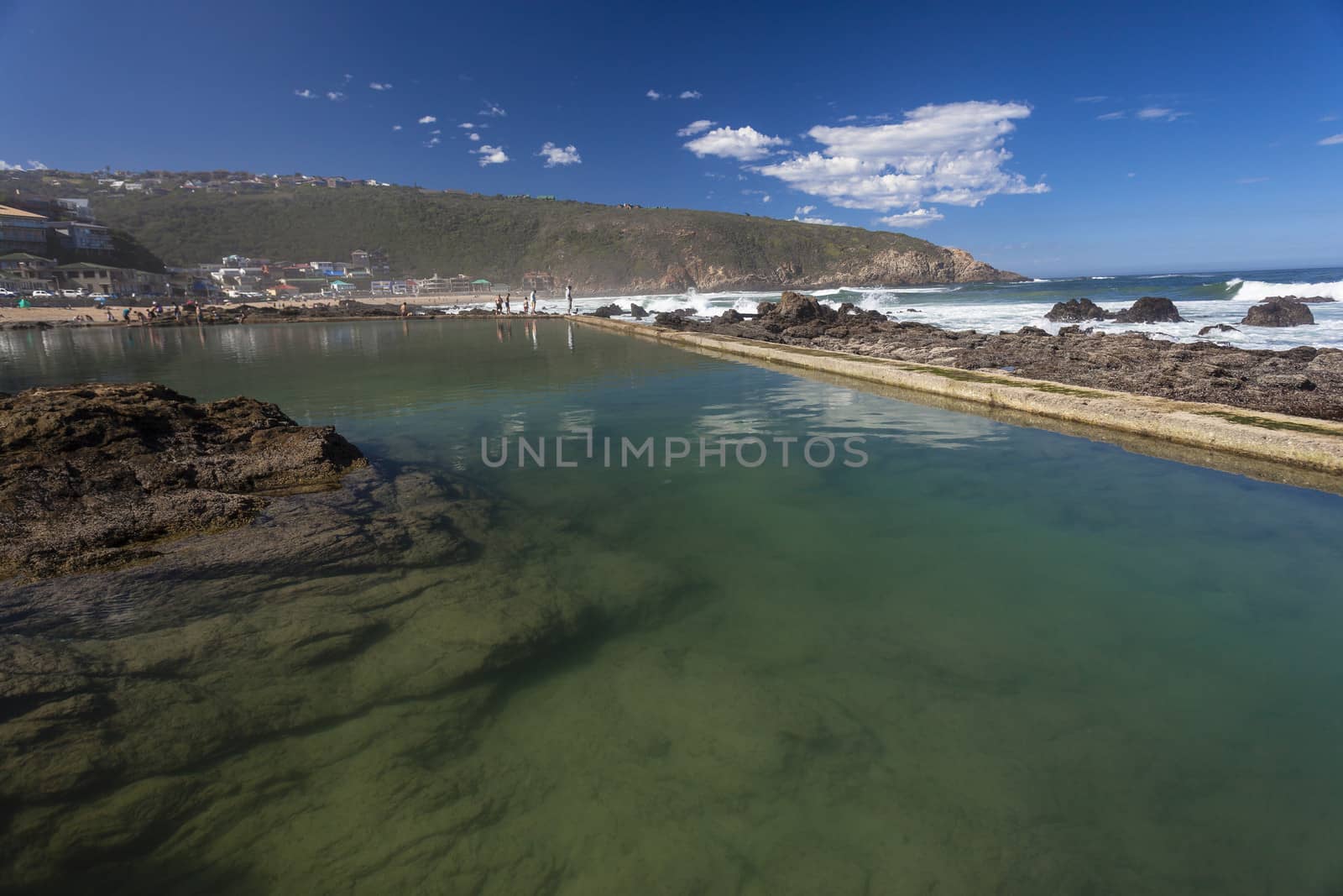 Rock concrete tidal pool landscape by the ocean sea waters at Herolds Bay South-Africa