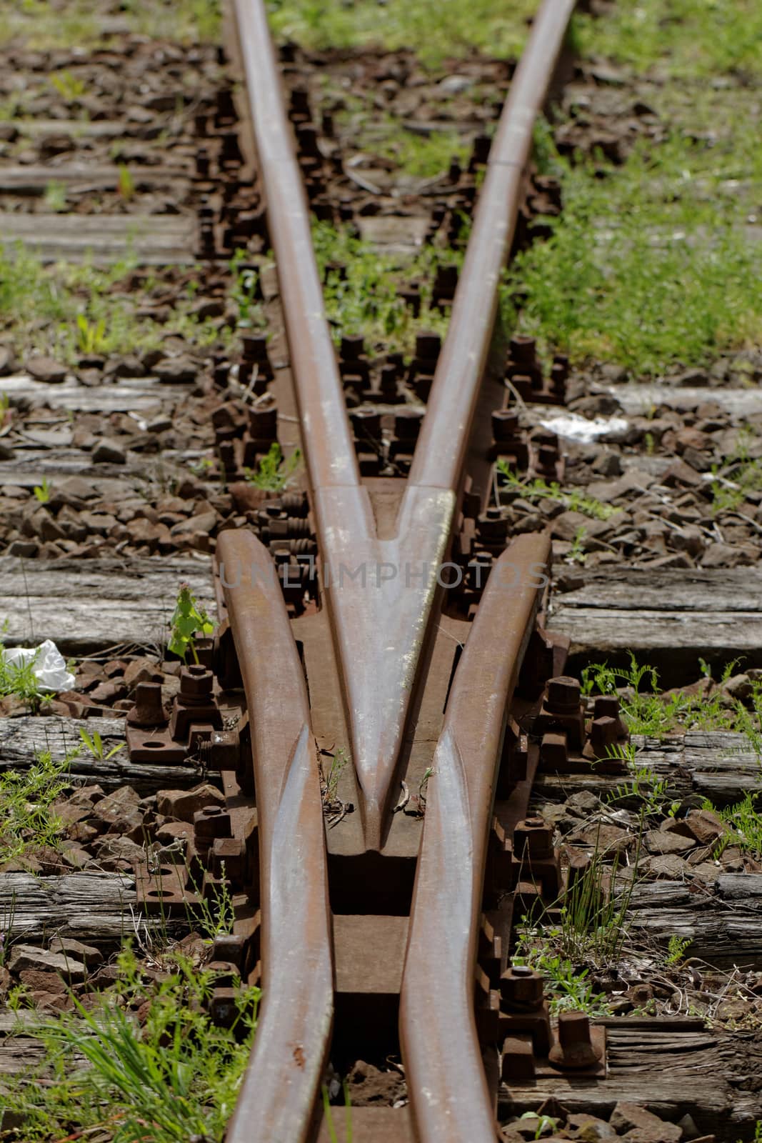 rusty railway track crossing