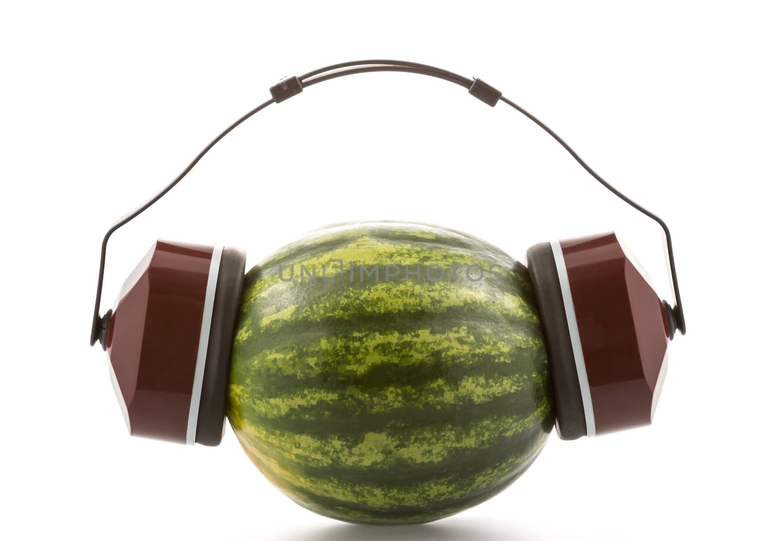 Industrial protective headphones on a melon, isolated on white background