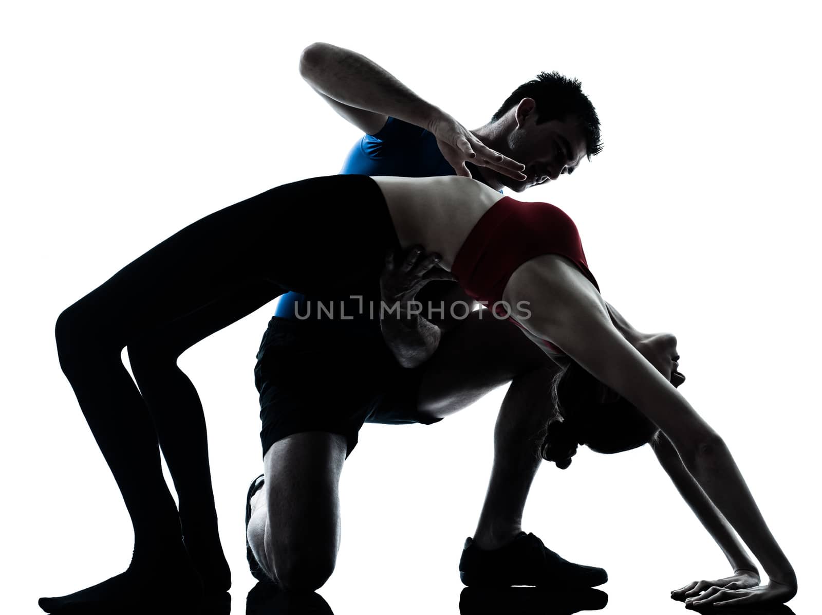 personal trainer man coach and woman exercising yoga bridge position gymnastic silhouette studio isolated on white background