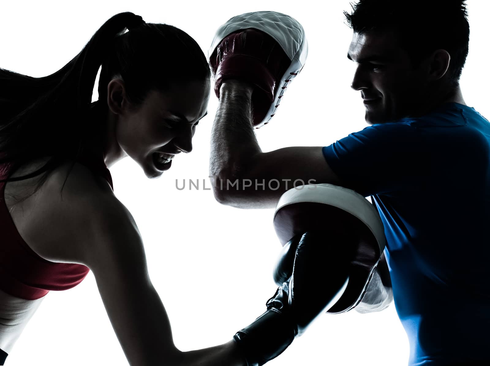 personal trainer man coach and woman exercising boxing silhouette studio isolated on white background