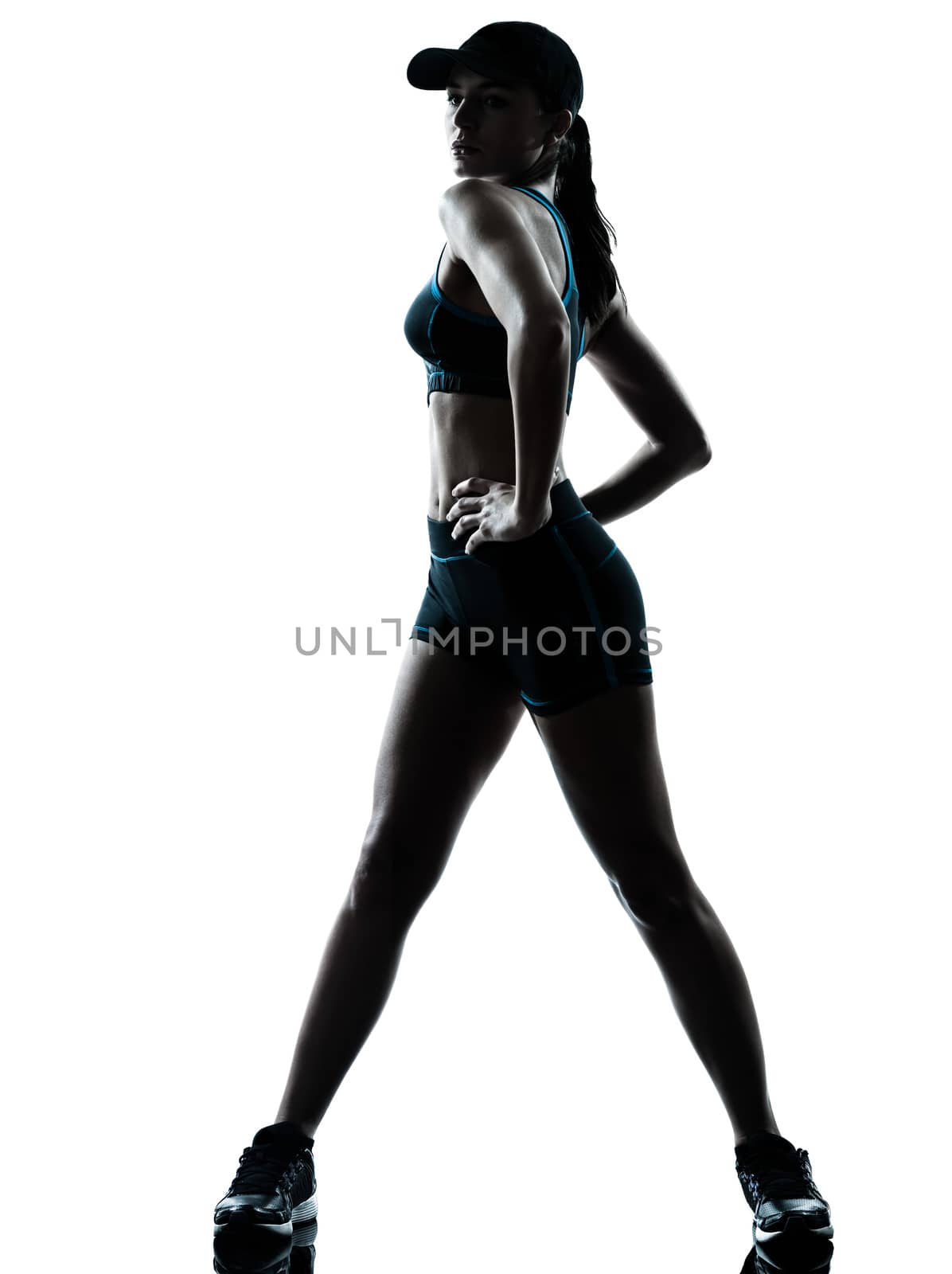 one caucasian woman runner jogger stretching in silhouette studio isolated on white background