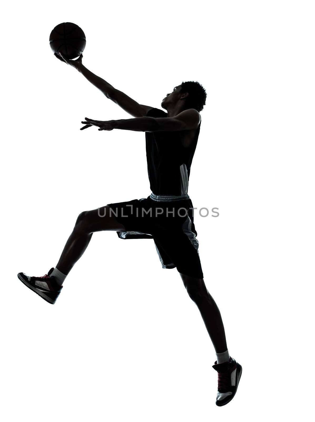 one young man basketball player silhouette in studio isolated on white background