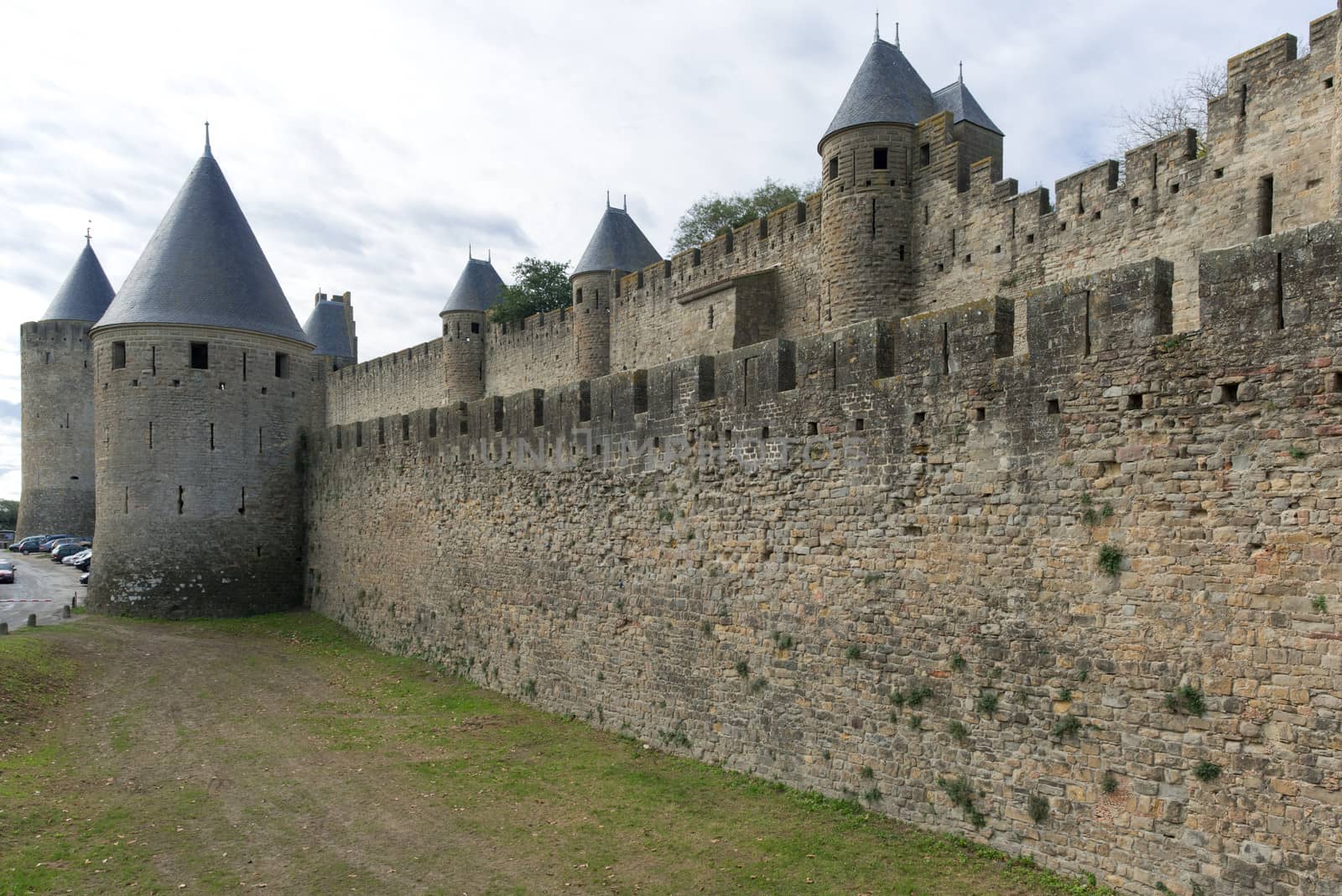 Carcassonne, France - November 2, 2013: View of the medieval walled city of Carcassonne and its castle on a sunny day.