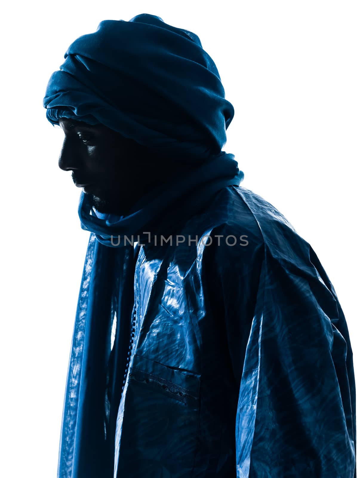 one Tuareg Portrait in silhouette studio isolated on white background