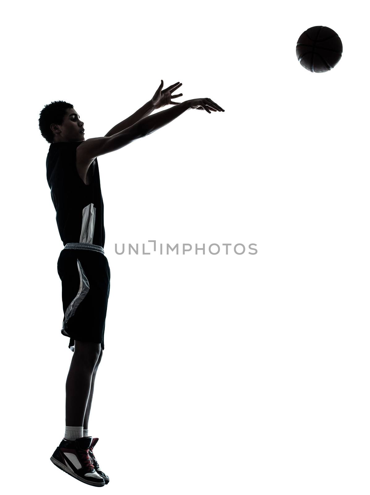 one young man basketball player silhouette in studio isolated on white background