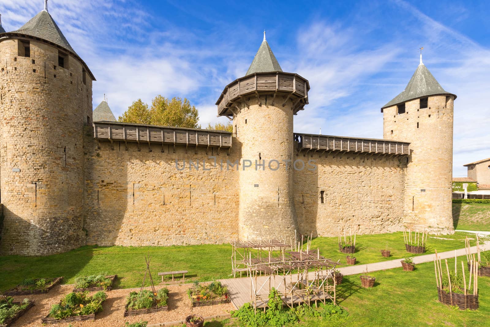 Carcassonne, France - November 2, 2013: View of the medieval walled city of Carcassonne and its castle on a sunny day.