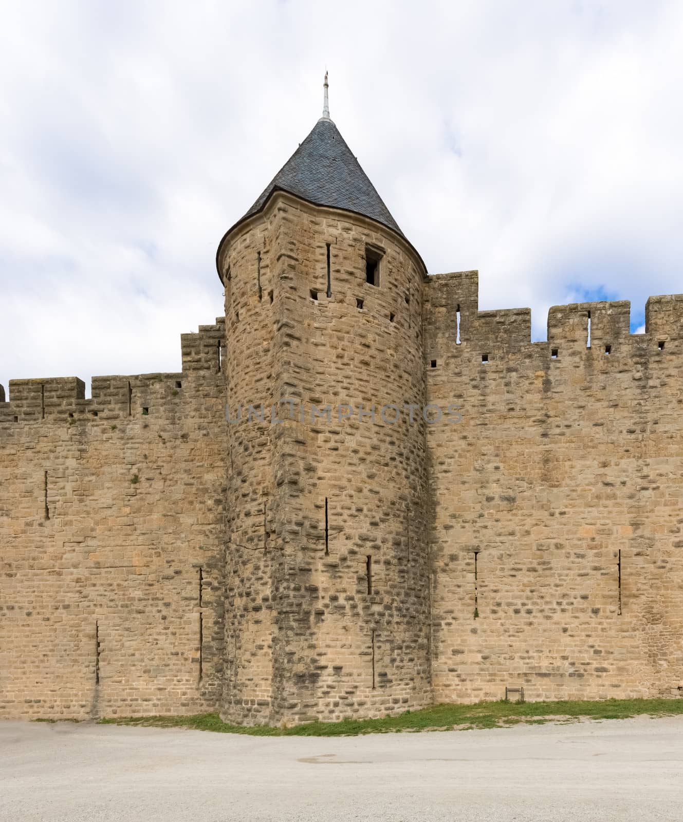 Carcassonne, France - November 2, 2013: View of the medieval walled city of Carcassonne and its castle on a sunny day.