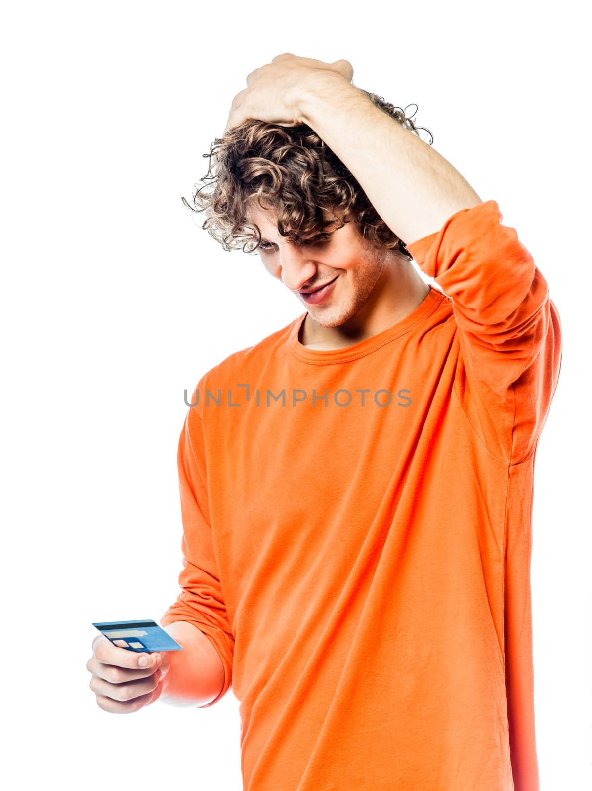 one young man caucasian holding credit card portrait in studio white background