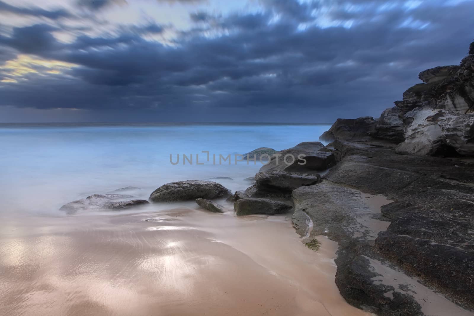 Stunning beach and coastal rocks before sunrise by lovleah