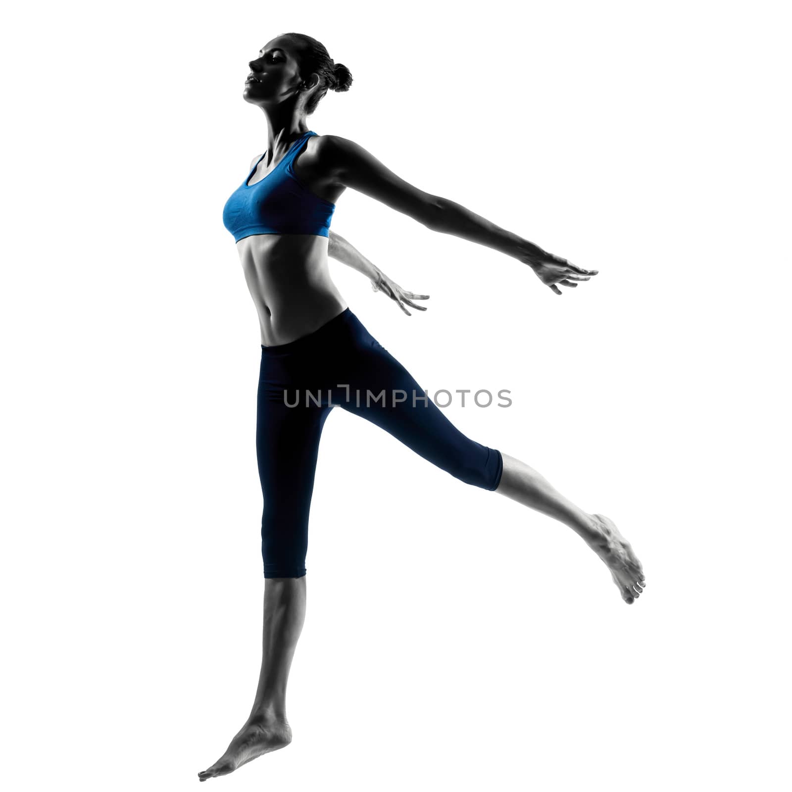 one caucasian woman exercising jumping stretching dancing in silhouette studio isolated on white background
