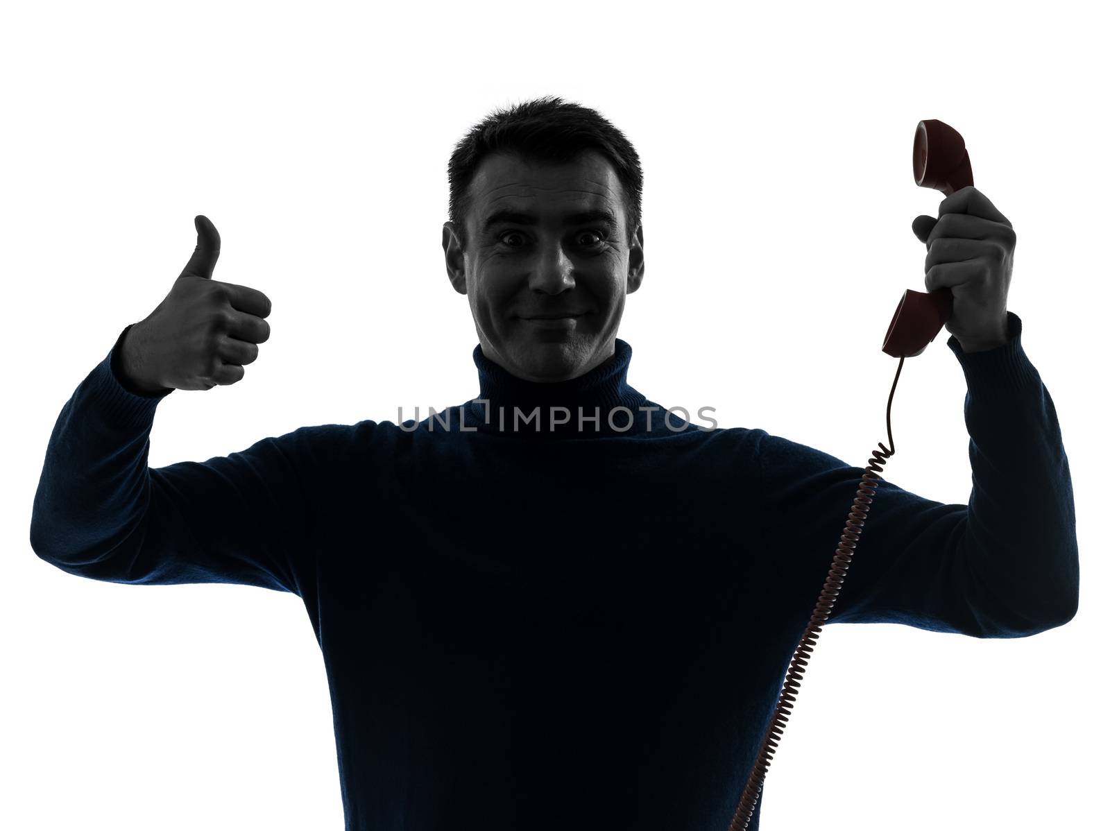 one caucasian man on the phone thumb up portrait in silhouette studio isolated on white background