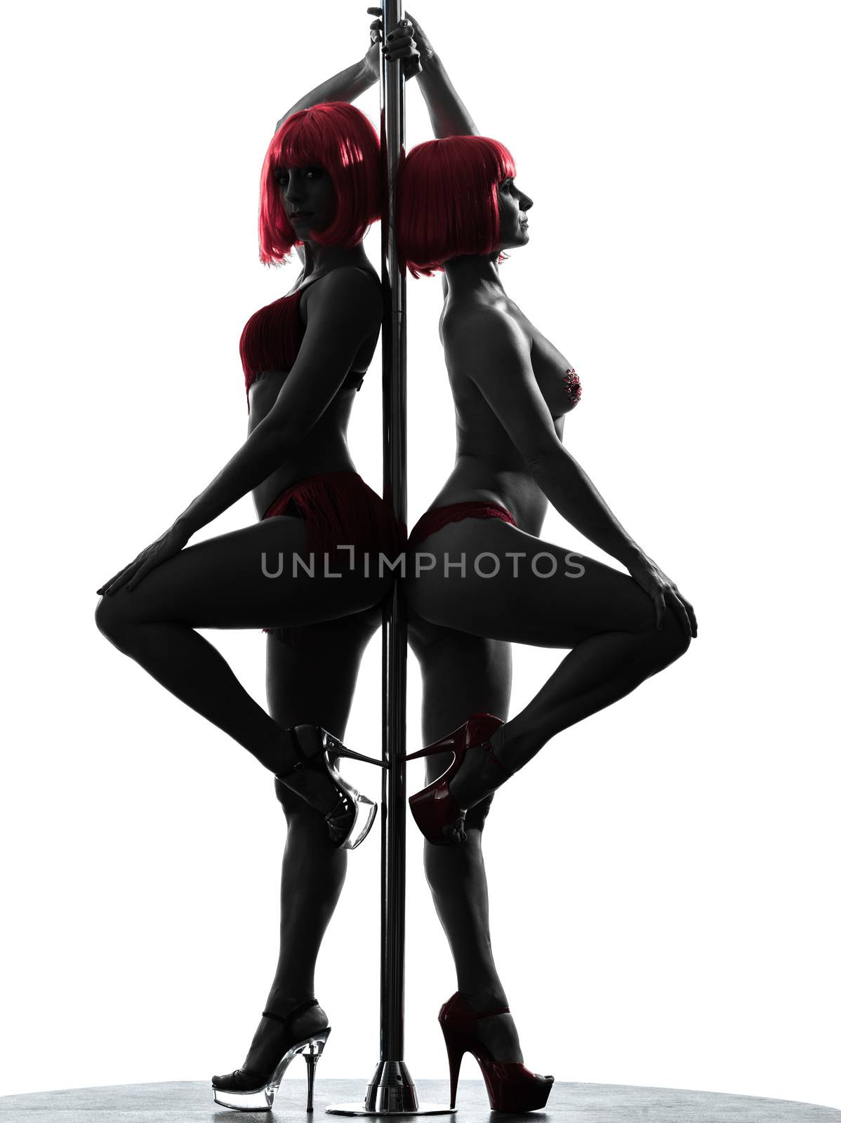 one caucasian woman pole dancer dancing in silhouette studio isolated on white background