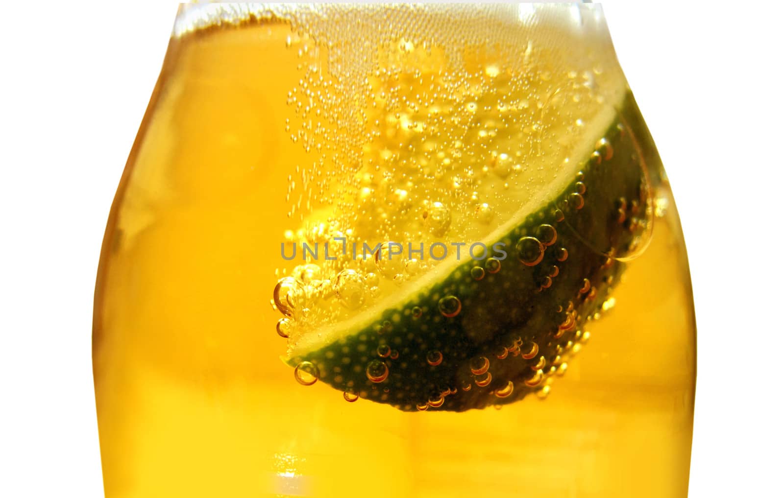 Close up of a slice of lime inside a bottle of beer 