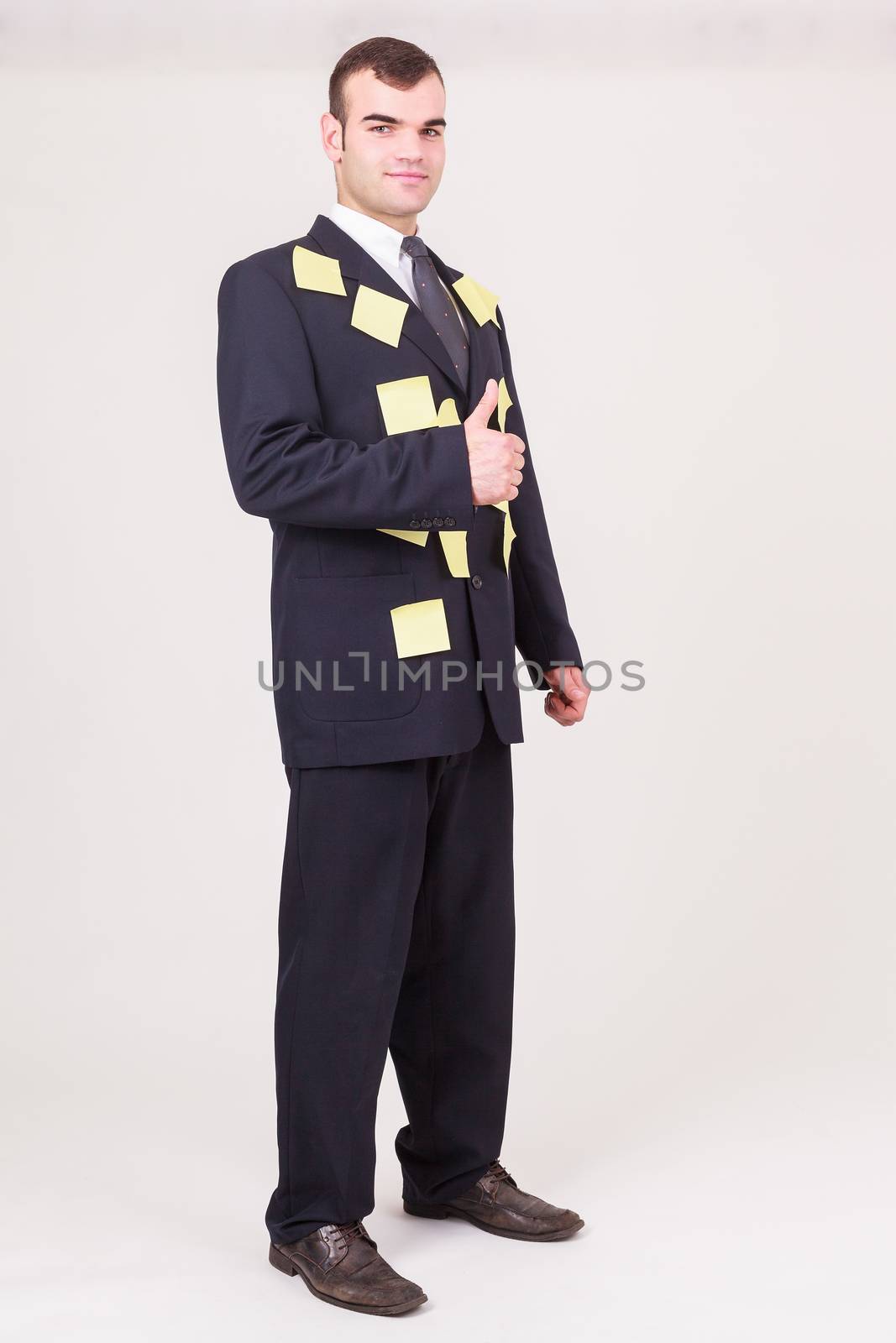Forgetful businessman with sticky notes by STphotography