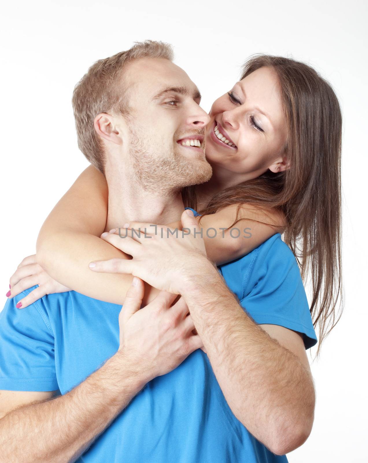 portrait of a happy young couple smiling, looking - isolated on white