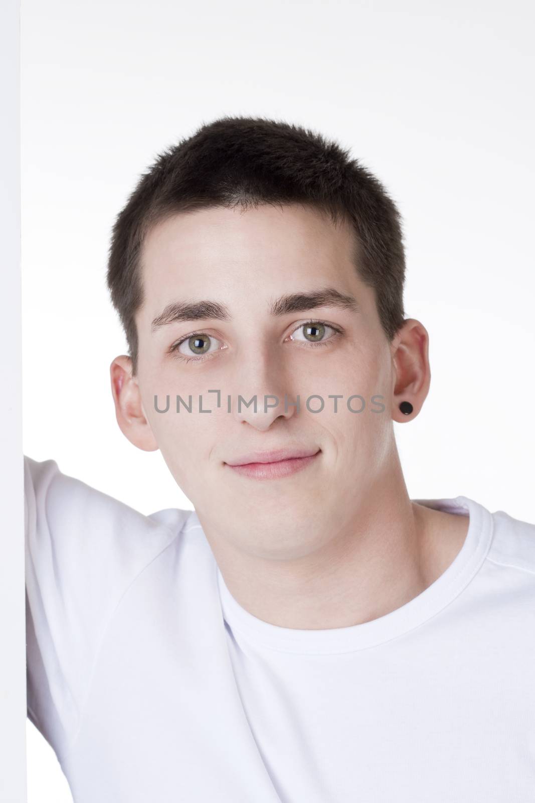 portrait of a young man with dark hair looking