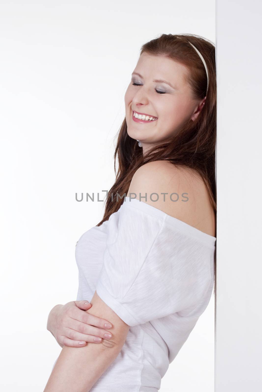 young beautiful young woman smiling with her eyes closed