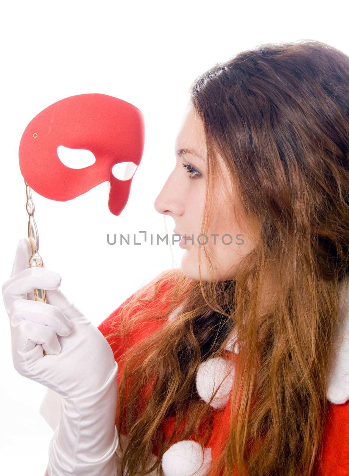 Woman removing the mask looks at her isolated on white background