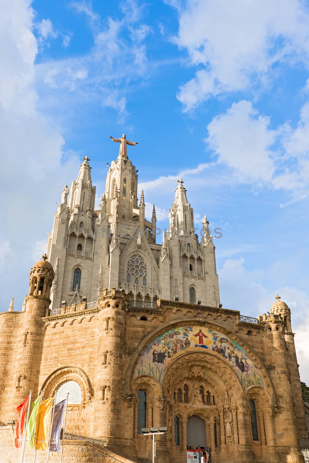 Barcelona, Spain - October 6, 2013: Tourist visiting Church of the Sacred Heart of Jesus on summit of Mount Tibidabo in Barcelona, Catalonia, Spain on sunny day in October 2013.