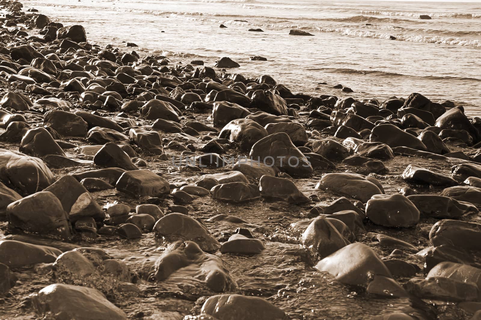 rocky coastline of a county Kerry beach on Irelands west coast in sepia