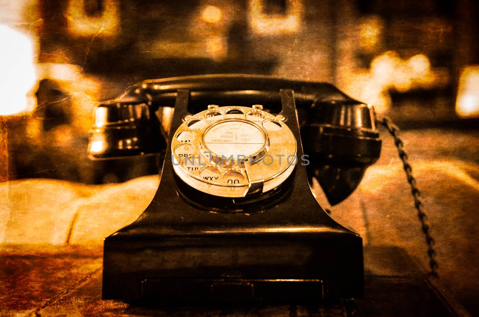 Detail view of old vintage dial telephone on the table  by martinm303