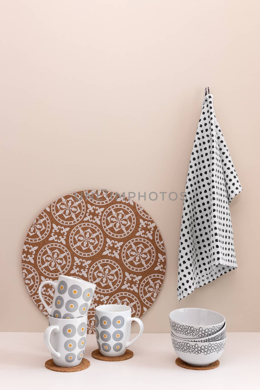 Stylish kitchen utensils. Cups, bowl, kitchen towel.