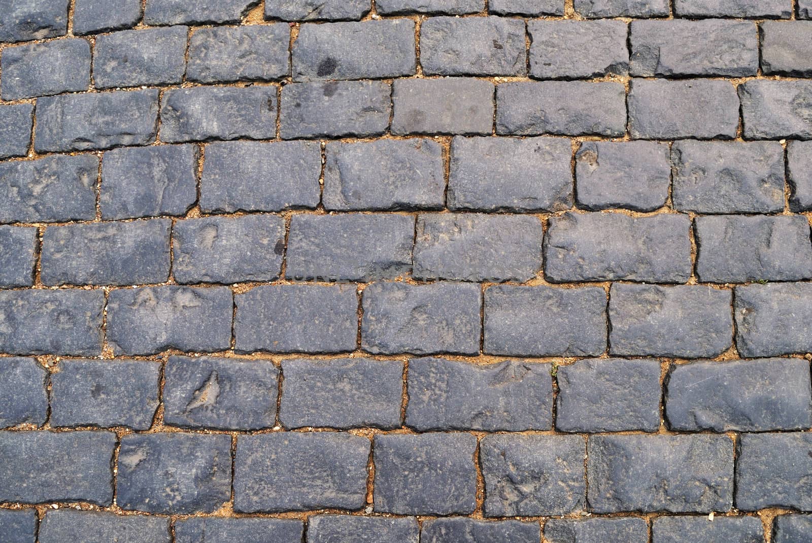 Fragment of old rough block pavement surface, Red Square in Moscow, Russia