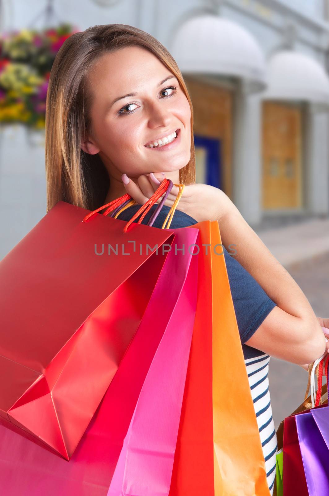 Woman Carrying Shopping Bags in a street