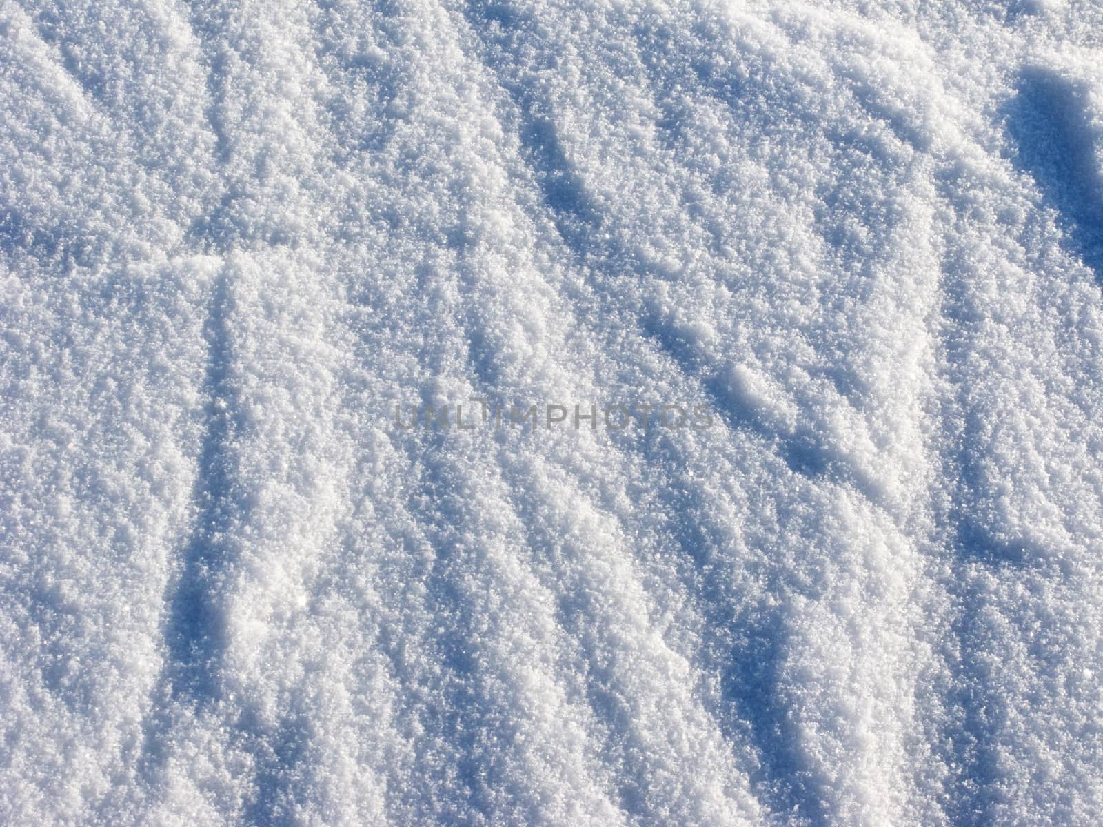 Texture of fresh snow surface on sunny day
