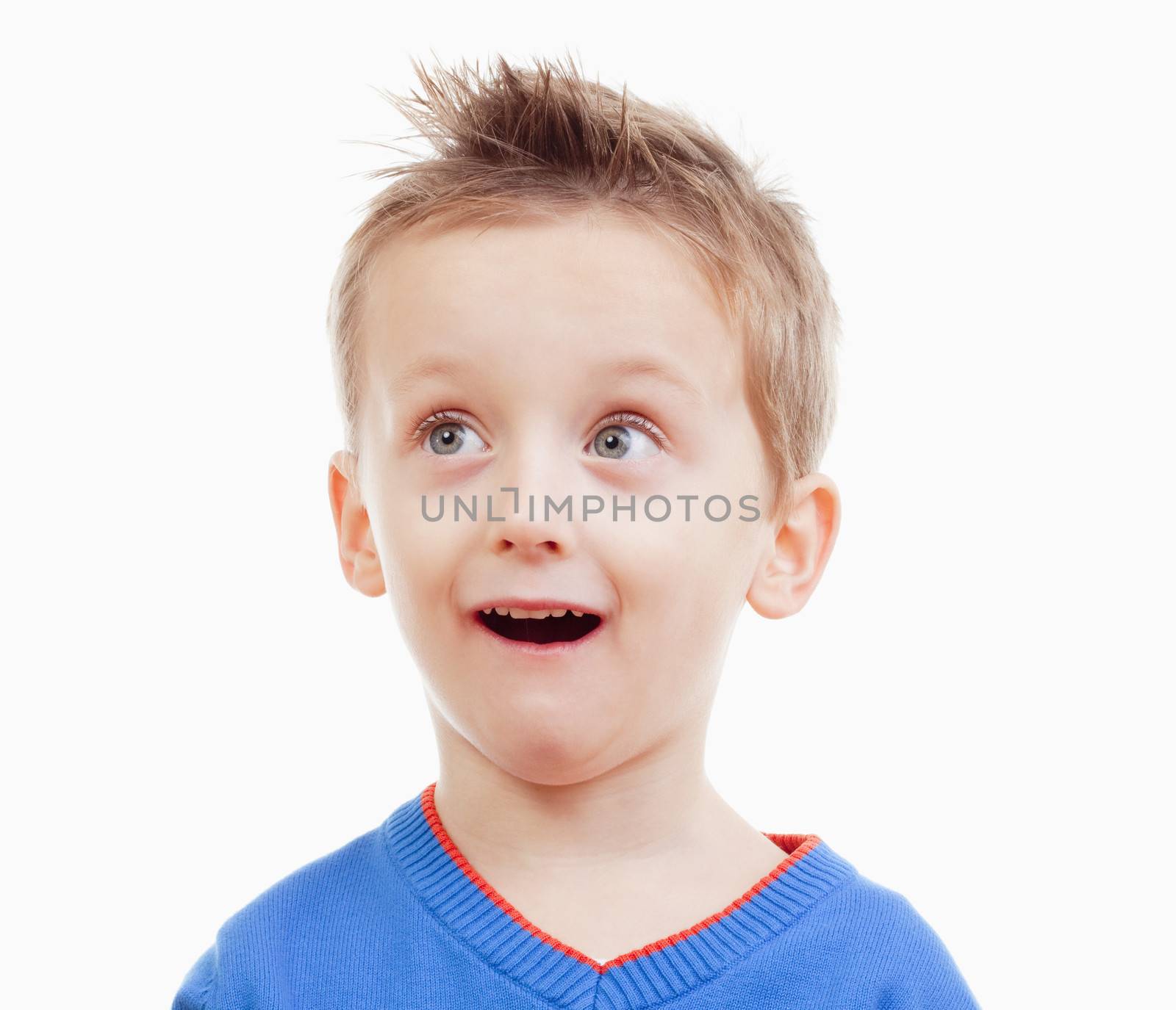 portrait of a boy with brown hair in blue top looking- isolated on white