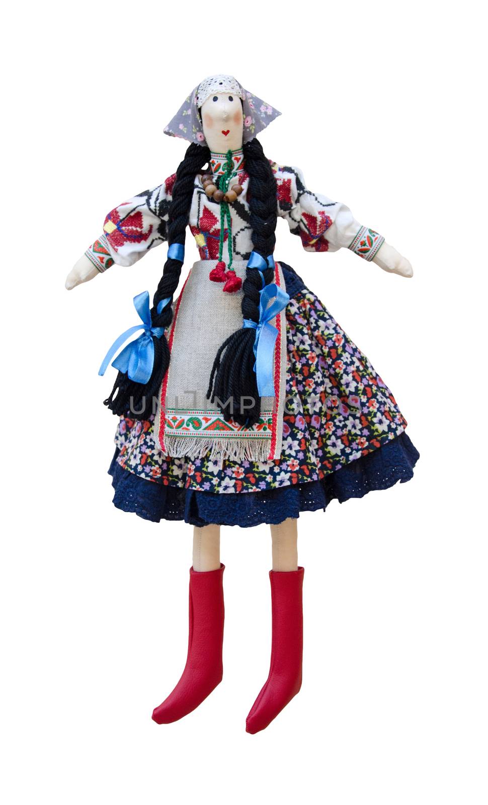 The Isolated handmade doll in the national Ukrainian costume with two pigtails