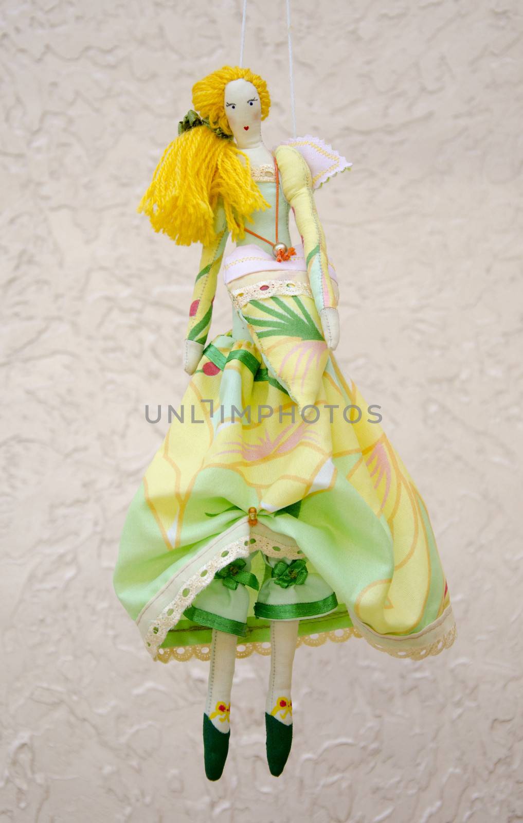 Handmade doll in a ball gown with wings and a bag in the shape of heart