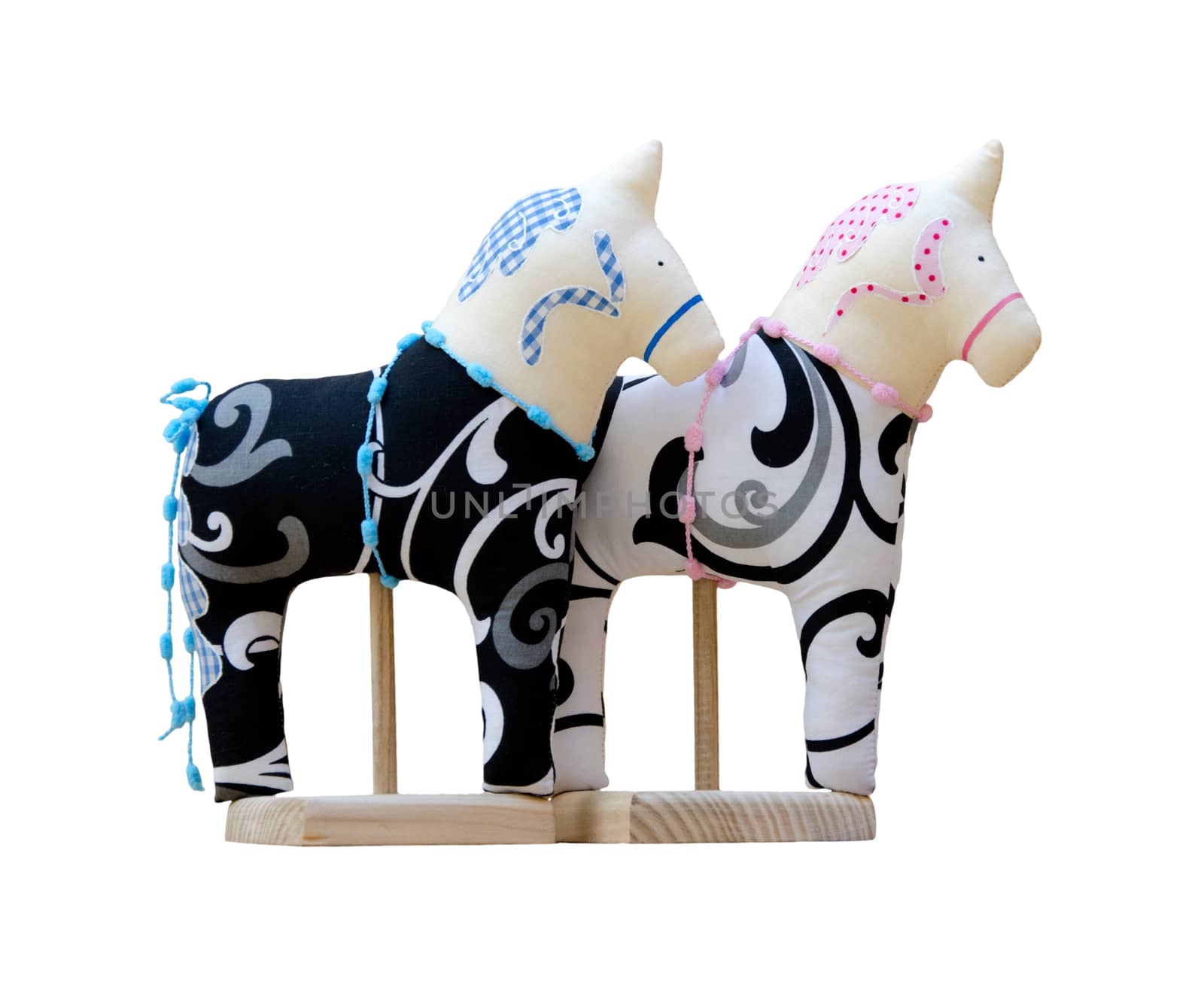 Hand made soft toy horse couple isolated on the stands by pt-home