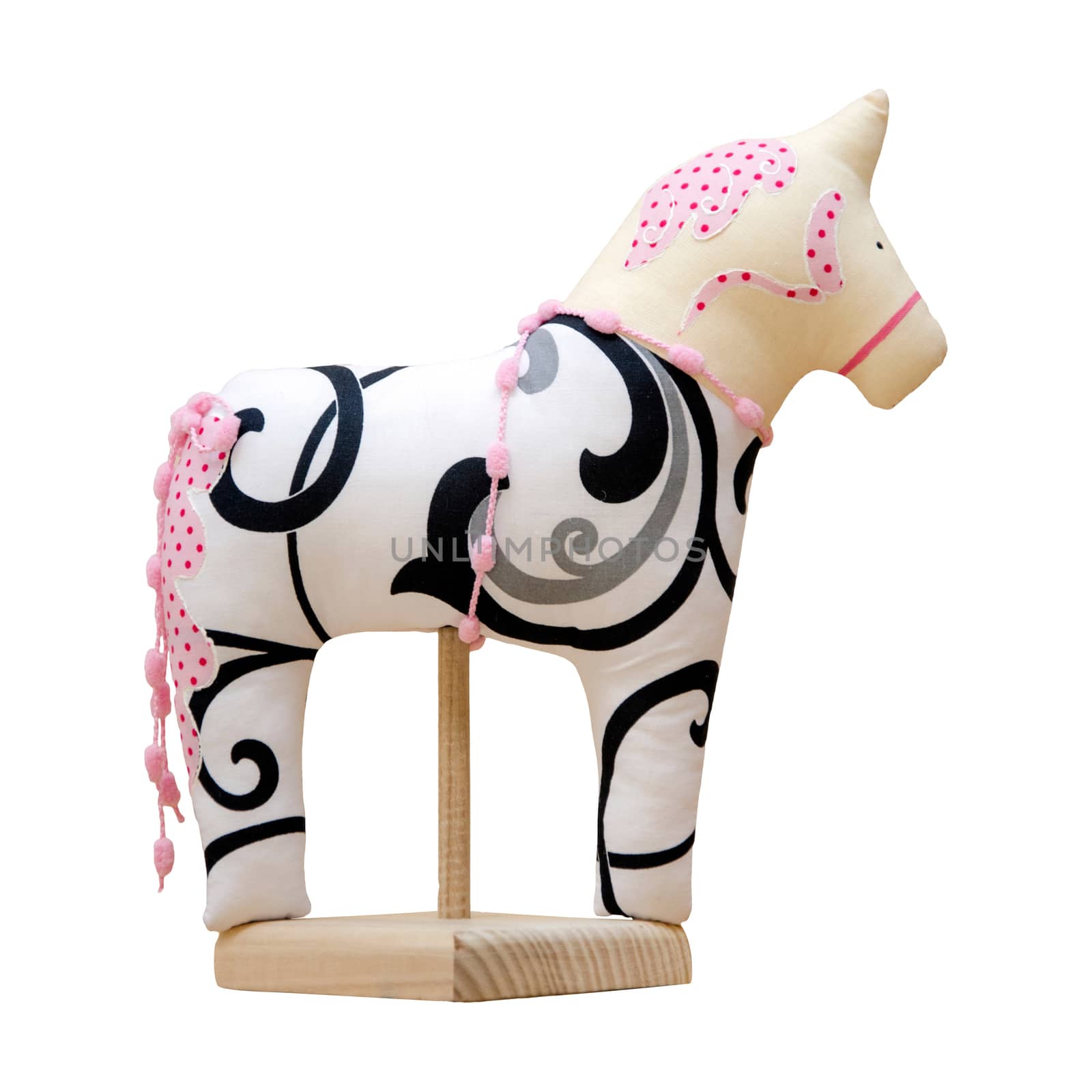 The Hand made soft toy horse isolated on white with pink on the stand